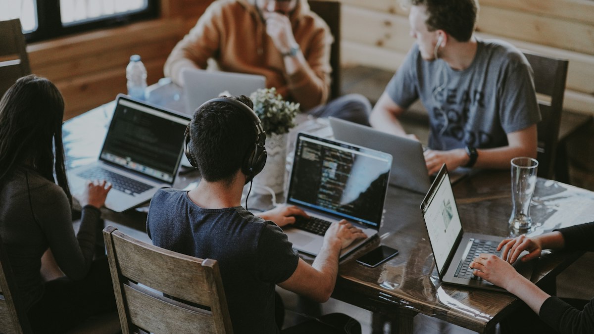 Software team working together on laptops
